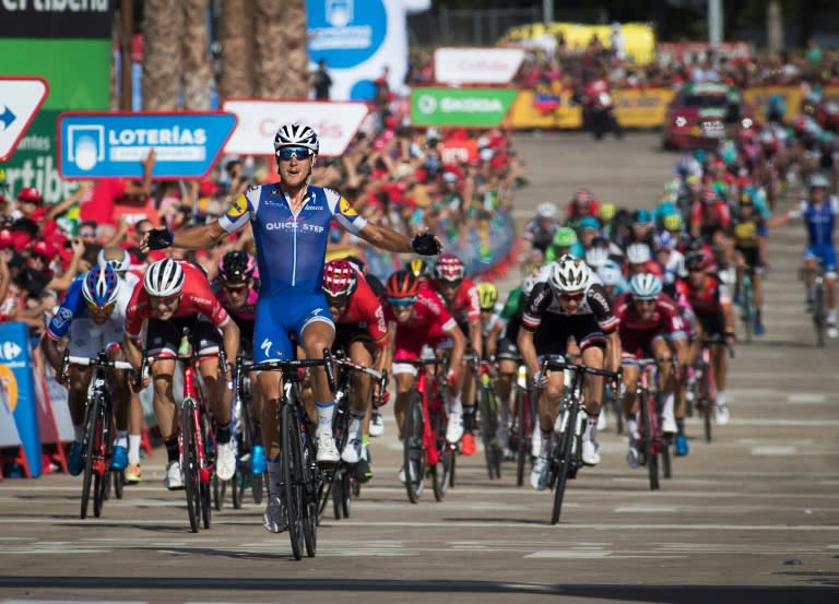 Quick-Step Floors Team's Italian cyclist Matteo Trentin celebrates as he crosses the finish line to win the fourth stage of "La Vuelta" Tour of Spain cycling race on August 22, 2017