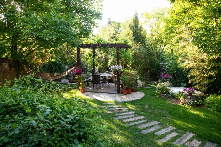 Create a cozy nook with a pergola.