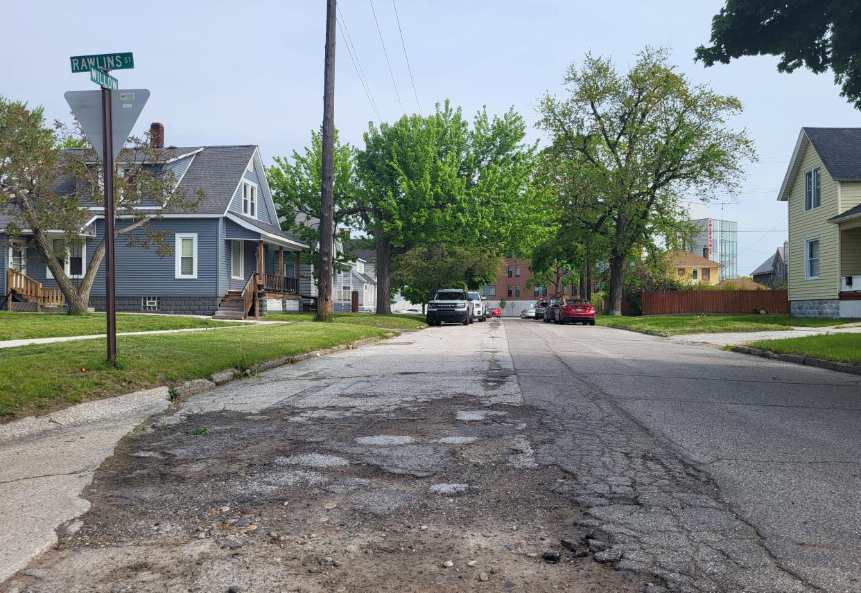 A section of crumbled pavement on Willow Street is shown on Wednesday, May 15, 2024, facing north toward McLaren Port Huron. That section of roadway and two others nearby were slated for reconstruction and utility replacement.