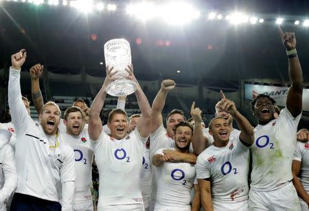 Rugby Union - Rugby Test - England v Australia's Wallabies - Sydney, Australia - 25/06/16. England Captain Dylan Hartley holds aloft the Australia - England test series trophy after winning their third game against Australia. REUTERS/Jason Reed