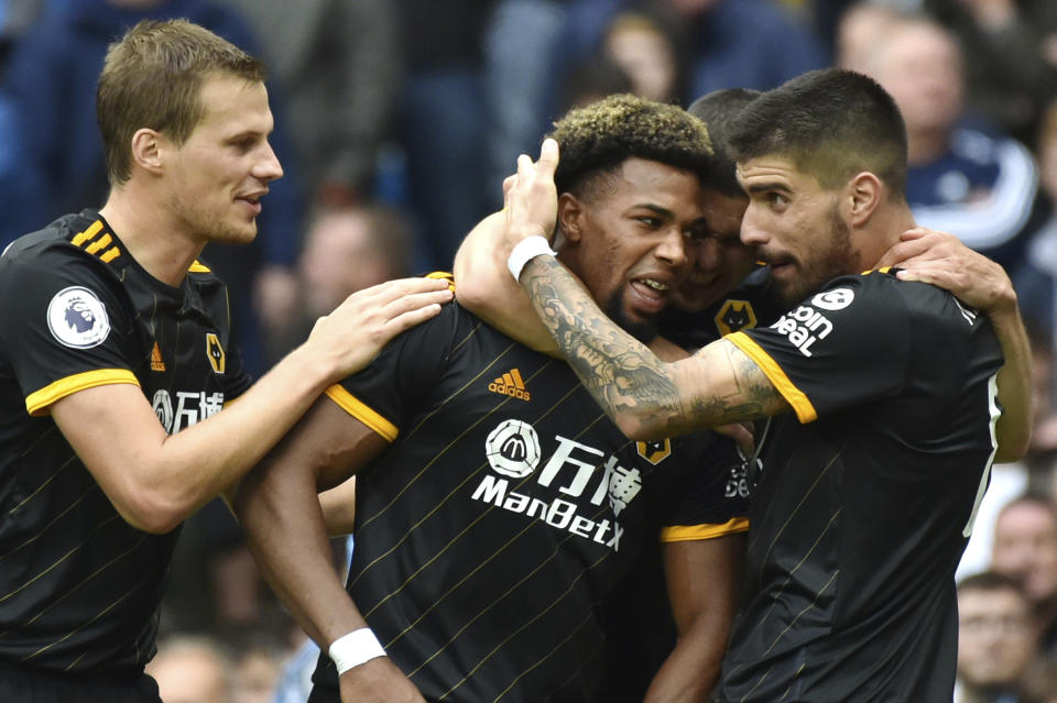 Wolverhampton Wanderers' Adama Traore, centre, celebrates with teammates after scoring during the English Premier League soccer match between Manchester City and Wolverhampton Wanderers at Etihad stadium in Manchester, England, Sunday, Oct. 6, 2019. (AP Photo/Rui Vieira)