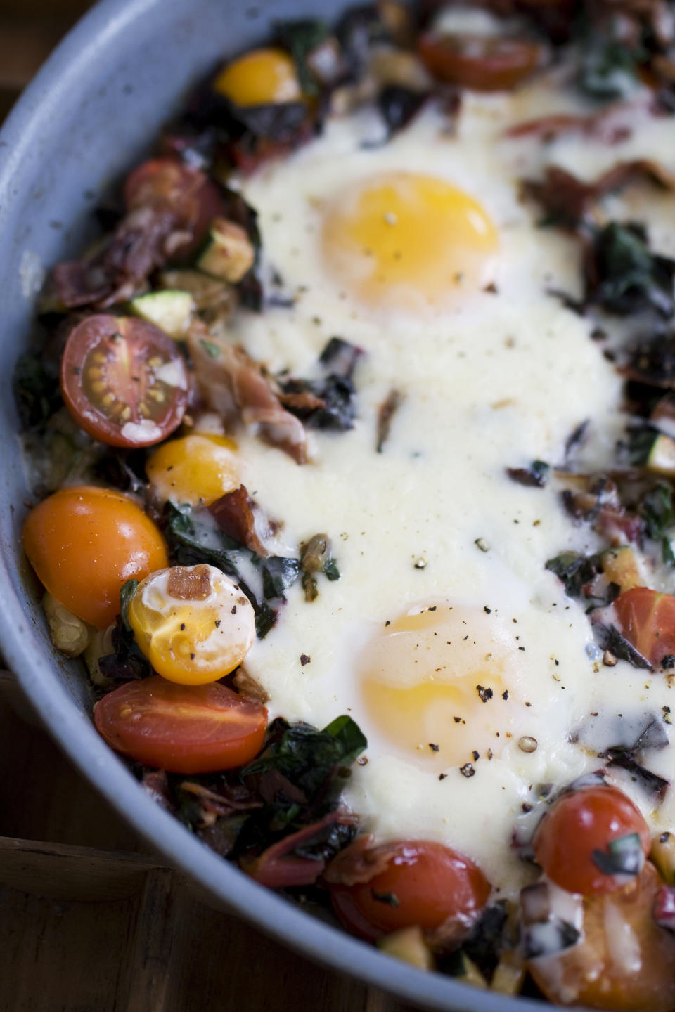 In this image taken on April 15, 20133, skillet garden eggs with fontina are shown in Concord, N.H. (AP Photo/Matthew Mead)