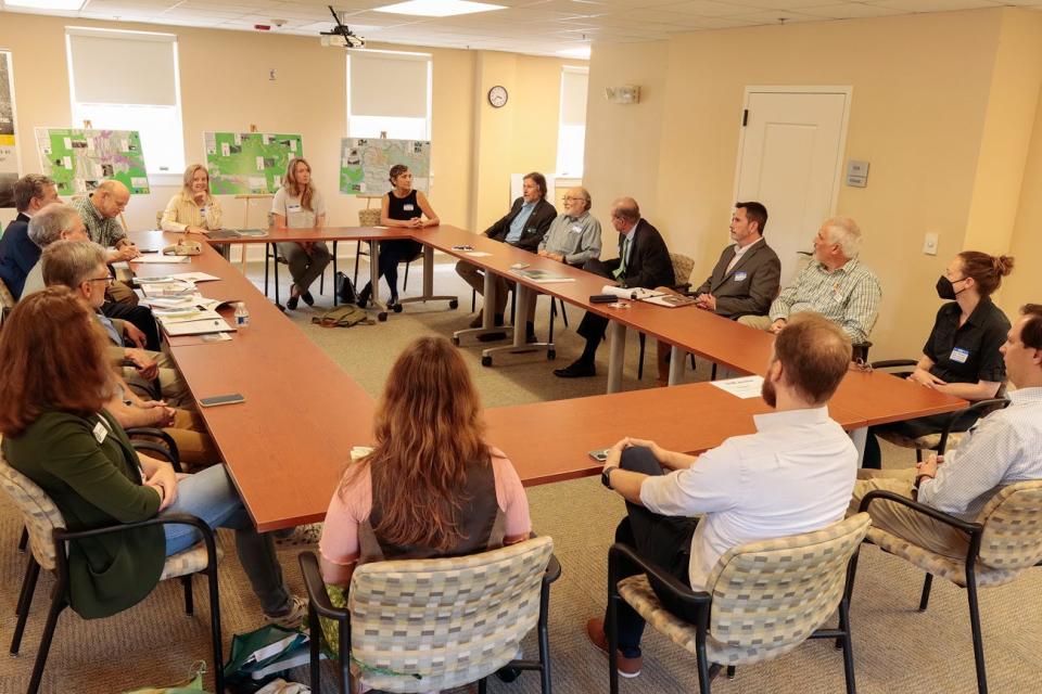 North Carolina Wildlife Resources Commissioner Brad Stanback speaks to N.C. Gov. Roy Cooper about Safe Passage: The I-40 Pigeon River Gorge Wildlife Crossing Project at a June 2 Asheville meeting.