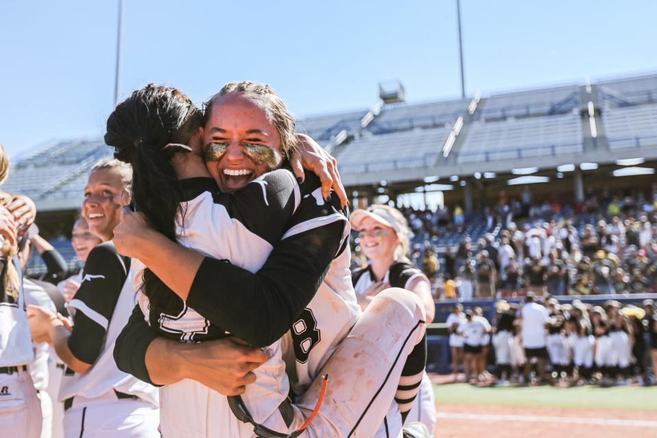 Lone Grove players celebrate after defeating Tecumseh 3-0 in the  Class 4A fastpitch state championship game Saturday at the USA Softball Hall of Fame complex.