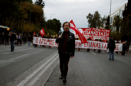 Protesters shout slogans as they march to the U.S. embassy during a rally marking the 45th anniversary of a 1973 student uprising against the military dictatorship that was ruling Greece, in Athens, Greece, November 17, 2018. REUTERS/Costas Baltas