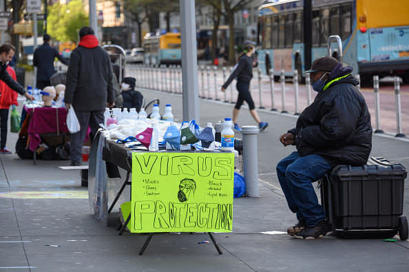 Face mask and cleaning products are sold at a stand in Union Square, New York, during the coronavirus pandemic.