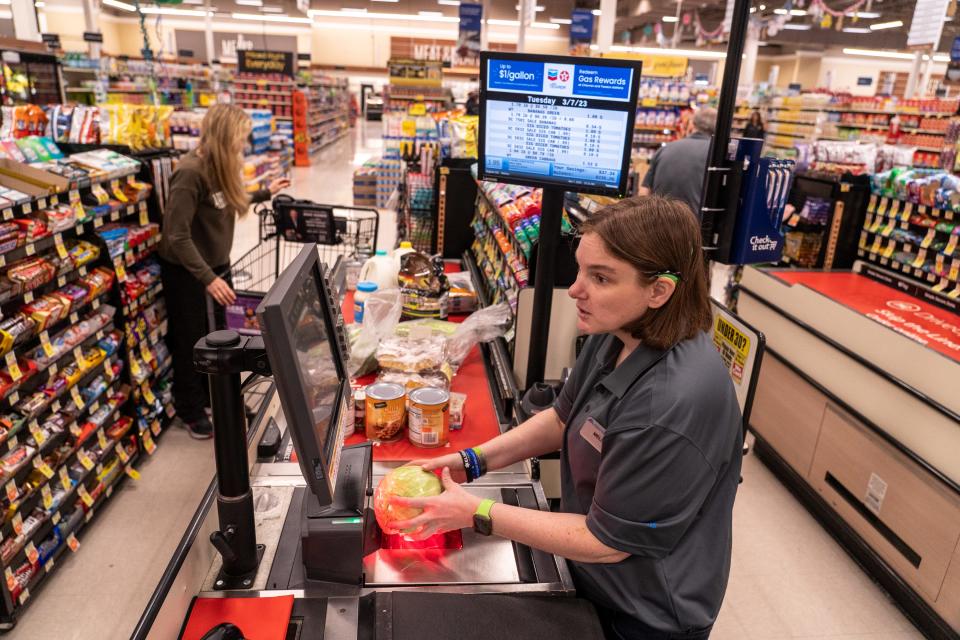 Albertsons employee Melissa Spellins, right, scans a customers groceries at the cashier at an Albertsons location at the Desert Ridge Marketplace in Phoenix on March 7, 2023.
