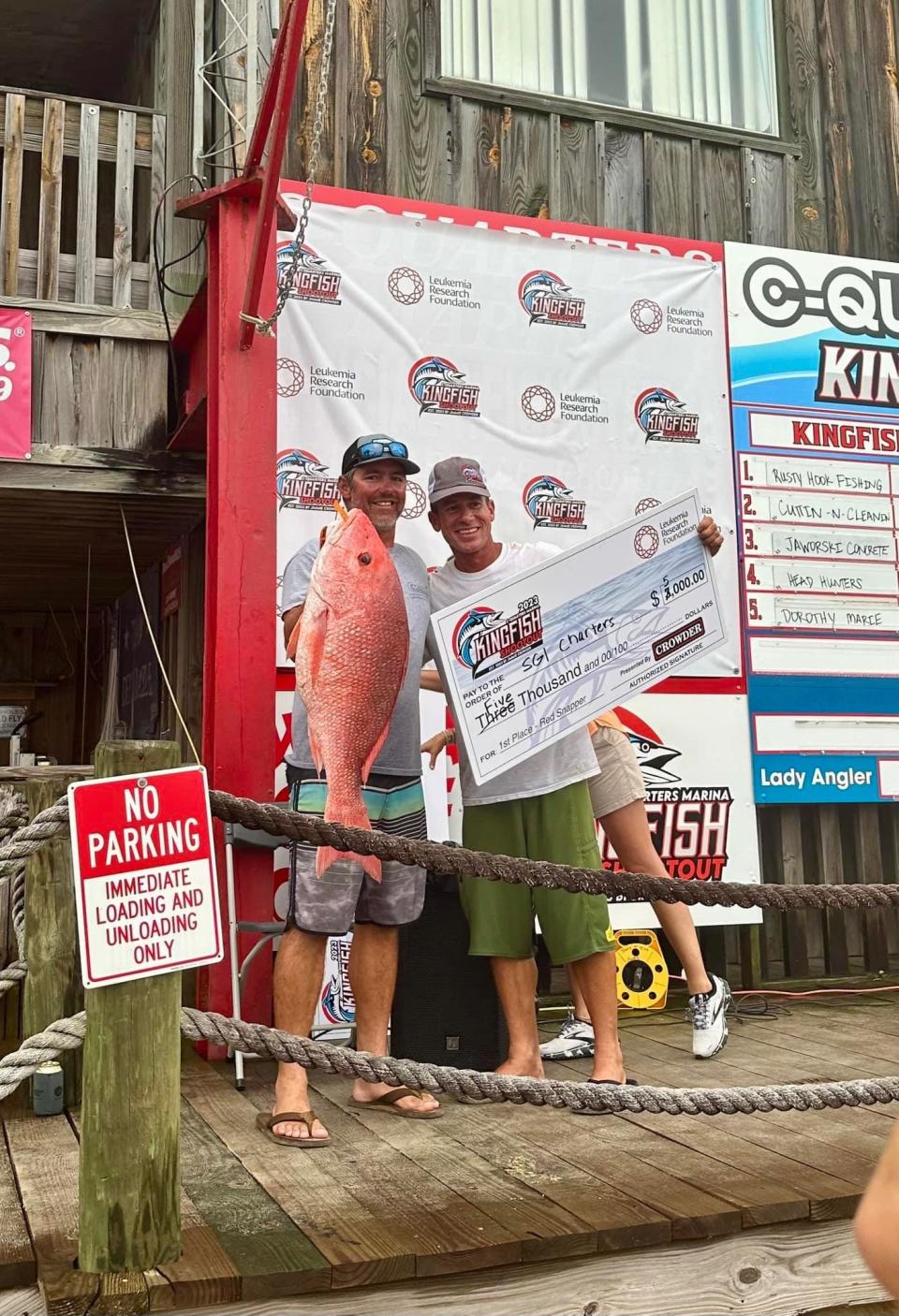 Captain Lee Chapin and 1st mate Griffen, hold up the winning Red Snapper from last weekend’s Kingfish Shootout out of Carrabelle
