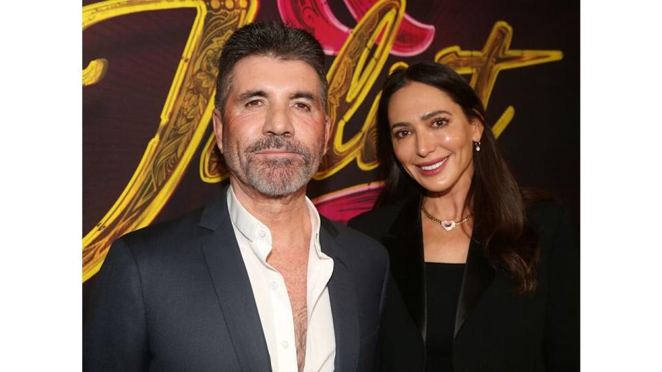 Simon Cowell and Lauren Silverman pose at the opening night of the new musical "& Juliet" on Broadway at The Stephen Sondheim Theatre on November 17, 2022 in New York City