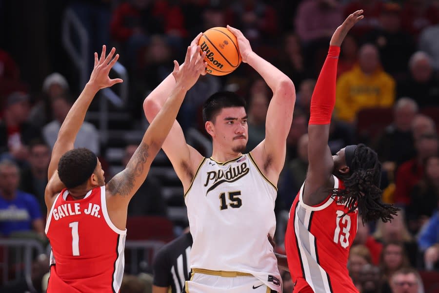 CHICAGO, ILLINOIS – MARCH 11: Zach Edey #15 of the Purdue Boilermakers is double teamed by Roddy Gayle Jr. #1 and Isaac Likekele #13 of the Ohio State Buckeyes during the first half in the semifinals of the Big Ten Tournament at United Center on March 11, 2023 in Chicago, Illinois. (Photo by Michael Reaves/Getty Images)