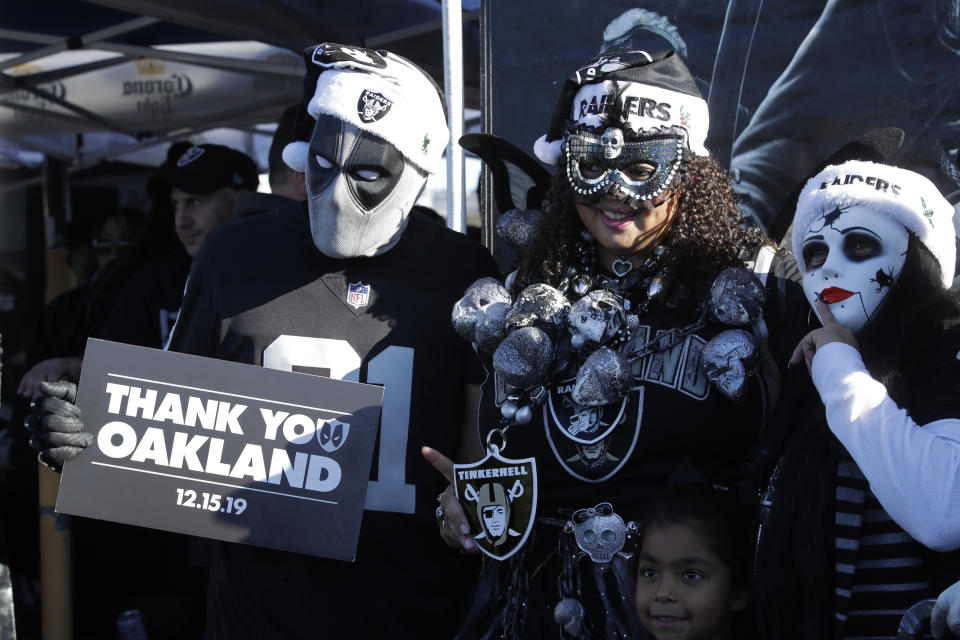 Oakland Raiders fans tailgate before the start of an NFL football game against the Jacksonville Jaguars in Oakland, Calif., Sunday, Dec. 15, 2019. The game is the final scheduled Raiders game in Oakland. (AP Photo/Ben Margot)