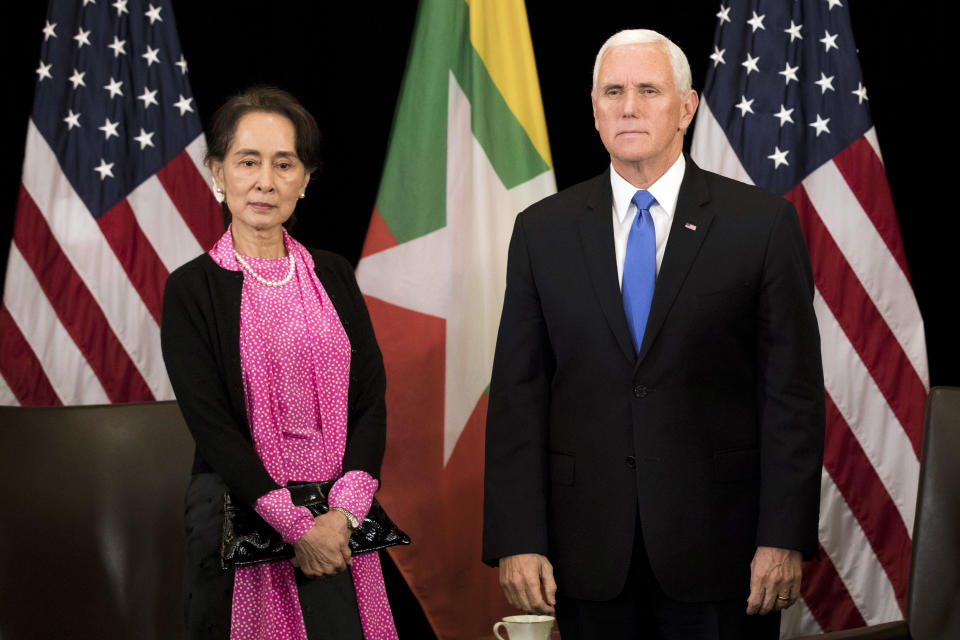 U.S. Vice President Mike Pence, right, meets Myanmar leader Aung San Suu Kyi in Singapore, Wednesday, Nov. 14, 2018. Pence is Singapore to attend the 33rd ASEAN summit. (AP Photo/Bernat Armangue, Pool)