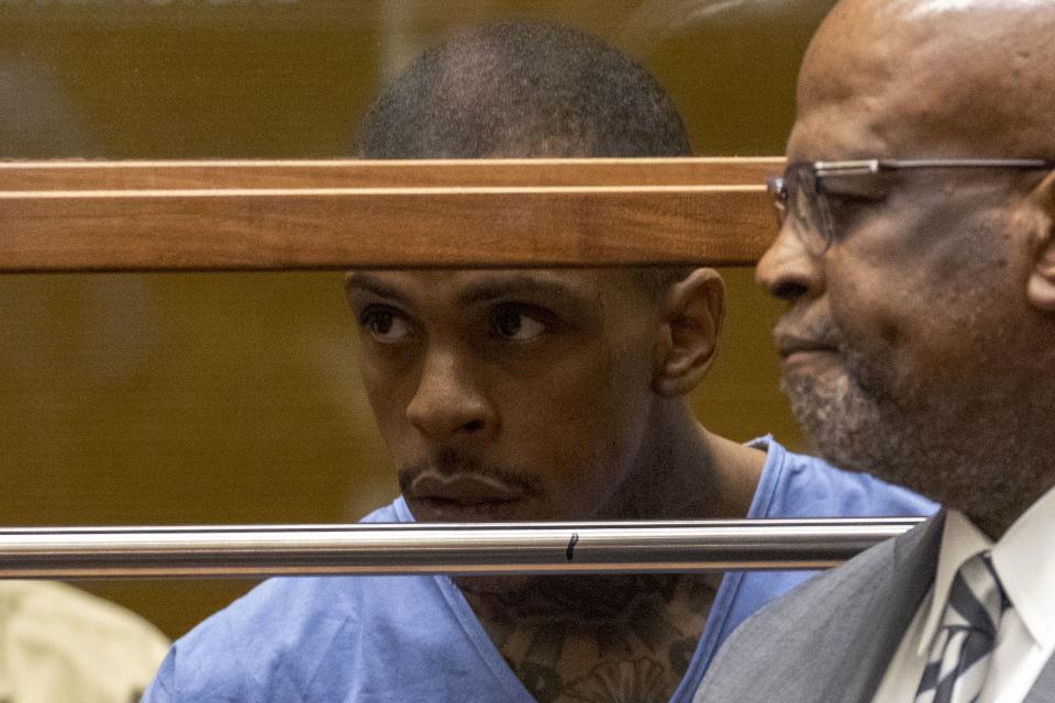 Eric Ronald Holder Jr., 29, who is accused of killing of rapper Nipsey Hussle, appears for arraignment with his Attorney Christopher Darden (R) on April 4, 2019 in Los Angeles, California.