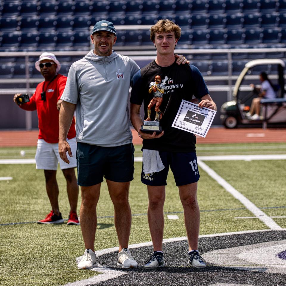 Mike McCarthy -- a 2015 Bridgewater State graduate, BSU Hall-of-Famer and founder of the M2 Quarterback Academy -- stands with Needham High QB Josh Morant after a camp at Stonehill College.