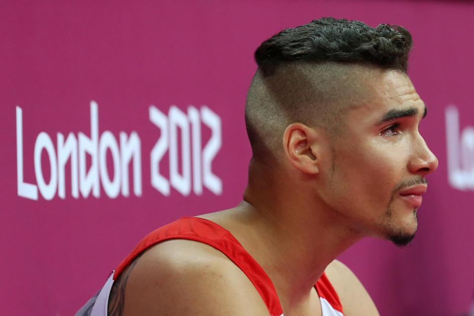Louis Smith of Great Britain reacts after the hearing his score in the pommel horse in the men's qualification session for Artistic Gymnastics Men's Team on day one of the London 2012 Olympic Games at North Greenwich Arena on July 28, 2012 in London, England. (Photo by Ronald Martinez/Getty Images)