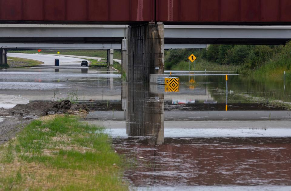 A flooded section of Interstate 275 near the Detroit Metropolitan Wayne County Airport in Romulus on Friday, Aug. 25, 2023.