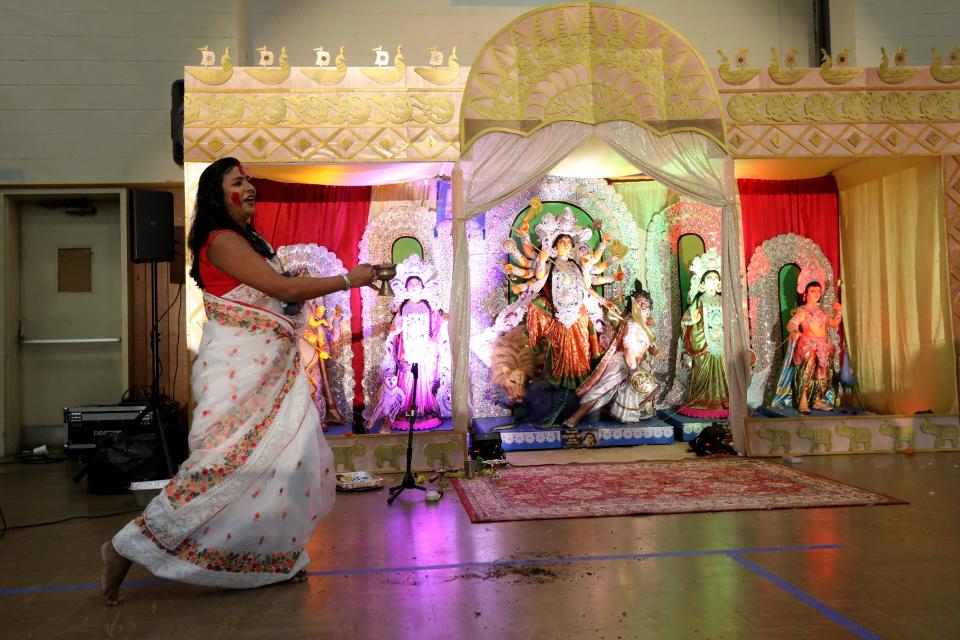 Priyanka Mudli, of Jersey City, performs a dhunuchi dance,  during Sharadotsav 2022, in Bergenfield. The dance is   performed to thank Goddess Durga.  Sunday, October 2, 2022