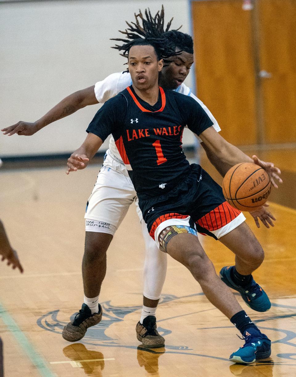 Lake Wales' Jeremy Willingham dribbles up the court gainst Lake Region on Tuesday night in the first round of the Class 5A, District 7 boys basketball tournament.