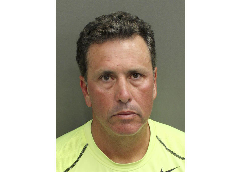 FILE - This undated photo provided by Orange County Corrections shows Gustavo Falcon, the last of South Florida's "Cocaine Cowboys". Falcon was arrested Wednesday, April 12, 2017, some 26 years after he went on the lam, while on a 40-mile bike ride with his wife near the Orlando suburb where they apparently lived under assumed names. Gustavo Falcon, 55, also known as Taby, was booked into the Orlando County jail, Wednesday. He is scheduled to have his first appearance in Orlando federal court on Thursday, before his expected transfer to Miami. (Orange County Corrections via AP)