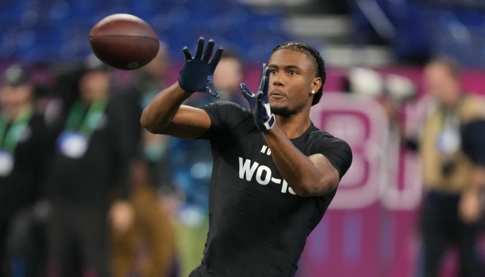Texas wide receiver Adonai Mitchell goes through drills last Saturday at the NFL scouting combine at Lucas Oil Stadium in Indianapolis.