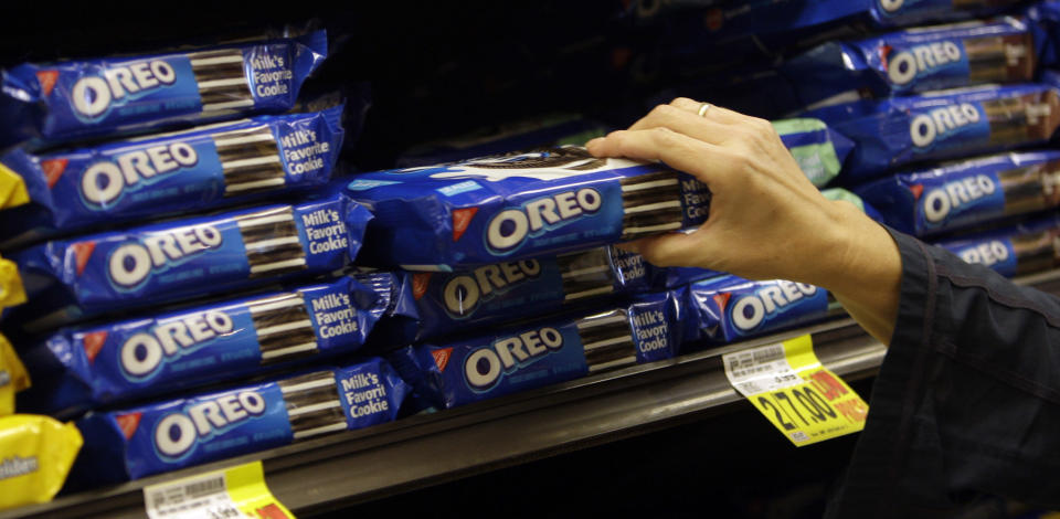 <p> FILE - In this Feb. 9, 2011 file photo, a shopper selects Oreo cookies at a Ralphs Fresh Fare supermarket in Los Angeles. Mondelez International Inc. reports quarterly financial results after the market closes on Wednesday, Aug. 7, 2013. (AP Photo/File)</p>