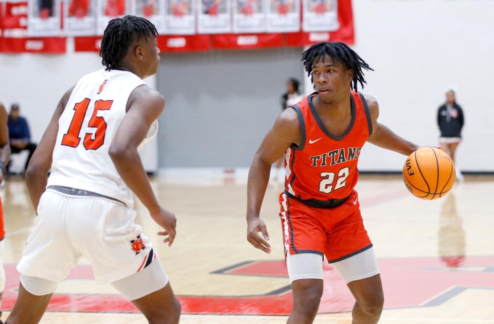 Carl Albert's Quincy Hopkins drives up court as Norman's Trashaun Combs-Pierce defends during a boy's high school basketball game between Carl Albert and Norman at the Titan Classic at Carl Albert High School in Midwest City, Okla., Friday, Jan.20, 2023.