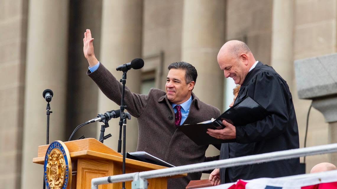 Attorney General Raúl Labrador waves to the crowd after being sworn into office by Idaho Chief Justice G. Richard Bevan on the steps of the Idaho Capitol in January.