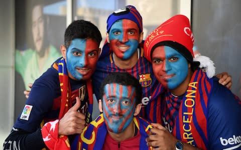 Face-painted Barca fans - Credit: Michael Regan/Getty Images