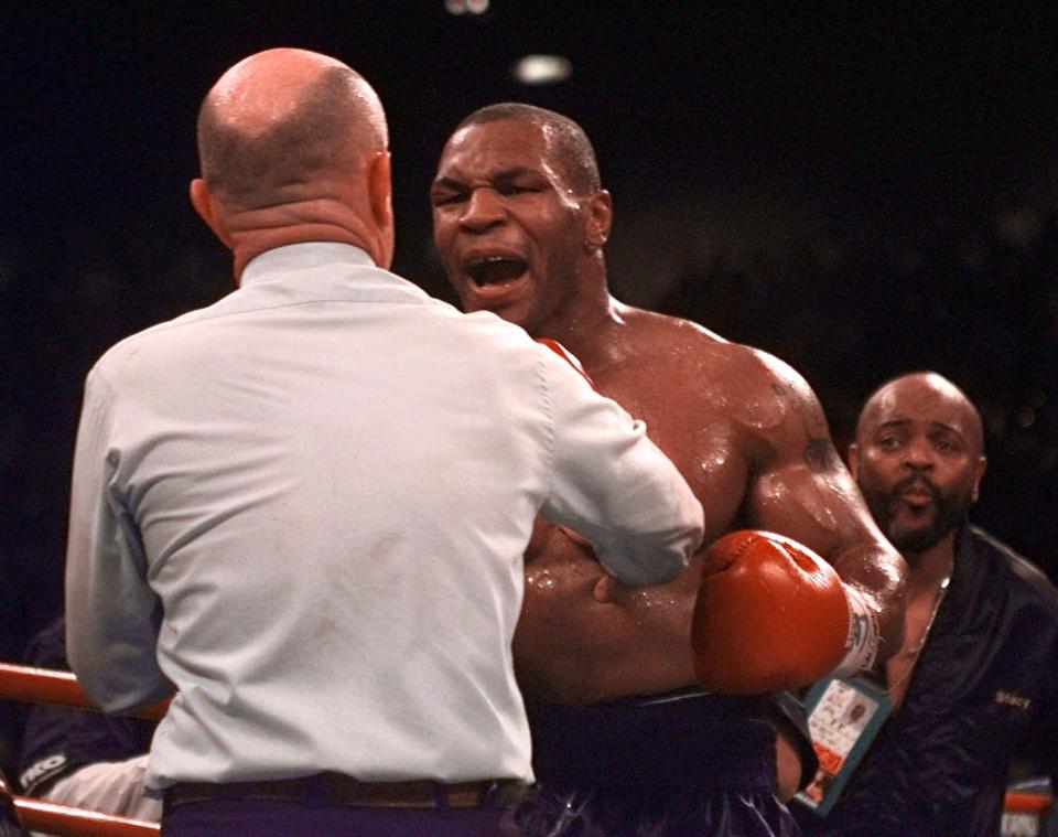 <p>Mike Tyson reacts to referee Mills Lane after Lane stopped the fight against Evander Holyfield in the third round of their WBA Heavyweight match after Tyson bit Holyfield’s ear for the second time Saturday, June 28, 1997, at the MGM Grand in Las Vegas. Holyfield retained his title. (AP Photo/Lenny Ignelzi) </p>