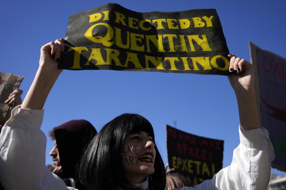 A student from drama school shouts slogans during a protest outside parliament in Athens, Greece on Thursday, Feb. 2, 2023. Performing artists and arts students are striking for a second day, closing theatres, halting television shoots and disrupting art school classes, to protest charges in the qualification system of civil service jobs. (AP Photo/Thanassis Stavrakis)