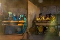 In Agadez, Niger, an Izala school educates about 1,300 students. Izala is a back-to-basics Islamic reformist movement that adheres to conservative practices, such as women covering their faces, but also prizes education. (National Geographic/Pascal Maitre)