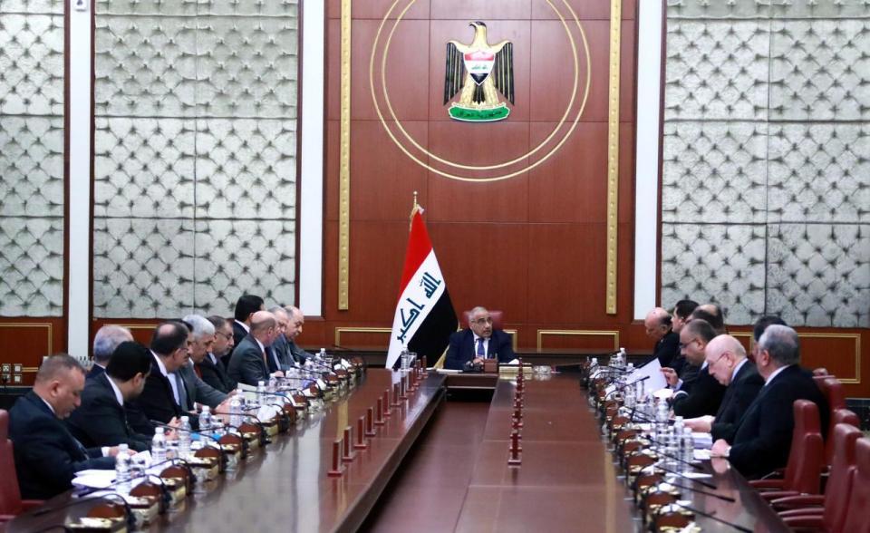 In a photo released by the Iraqi Prime Minister Media Office, Iraqi acting Prime Minister Adil Abdul-Mahdi, center, heads a cabinet meeting at the prime minister's office, in Baghdad, Iraq, Tuesday, Jan. 7, 2020. (Iraqi Prime Minister Media Office, via AP)