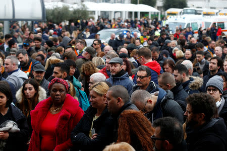 Passengers who were evacuated due to a fire at Ciampino Airport in Rome, Italy, February 19, 2019 gather outside the teminal building. REUTERS/Yara Nardi