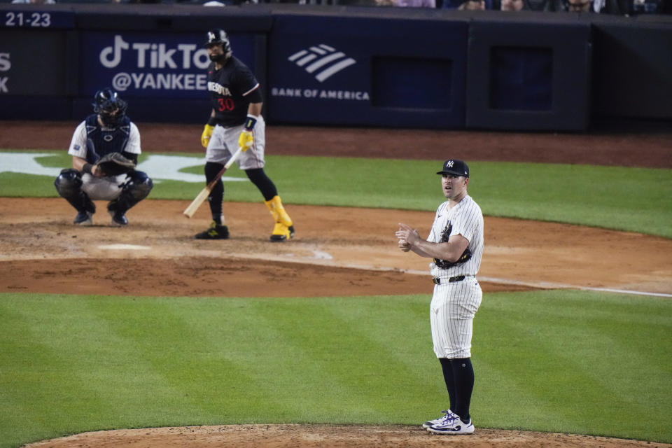 New York Yankees pitcher Carlos Rodón, right, pauses during an at-bat by Minnesota Twins' Carlos Santana during the sixth inning of a baseball game, Wednesday, June 5, 2024, in New York. (AP Photo/Frank Franklin II)