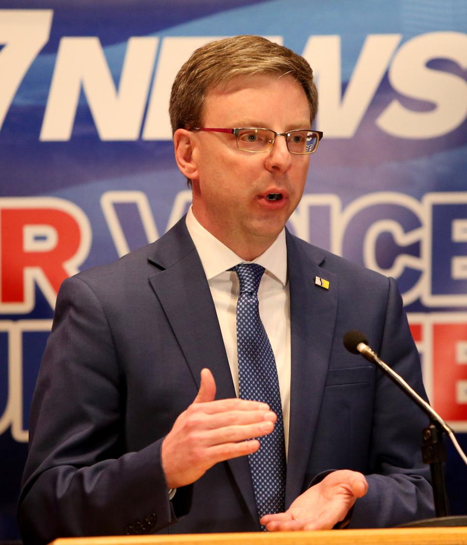 South Bend Mayor James Mueller makes a point against fellow Democratic candidate and Common Council member Henry Davis Jr. Wednesday, March 15, 2023, at the Democratic South Bend mayoral debate at Indiana University South Bend.