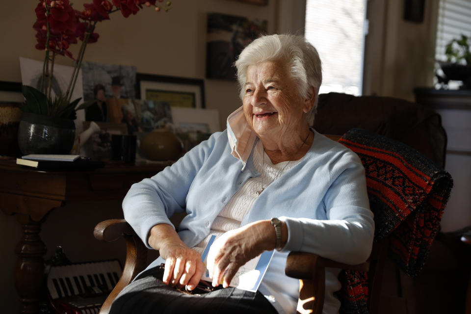 FILE - In this Nov. 12, 2020 file photo, Marjan Martin Curtis poses at her home in Spanish Fork, Utah. The 79-year-old widow, who has Stage 4 cancer, formed a fast and unlikely friendship with Amy Baird after Baird spotted Curtis' gorgeous gardening efforts along a nearby county road. (AP Photo/Jeff Swinger)