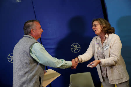 Republican candidate for Governor of Virginia Ed Gillespie speaks with a poll worker at Washington Mill Elementary School in Alexandria, Virginia, U.S., November 7, 2017. REUTERS/Aaron P. Bernstein