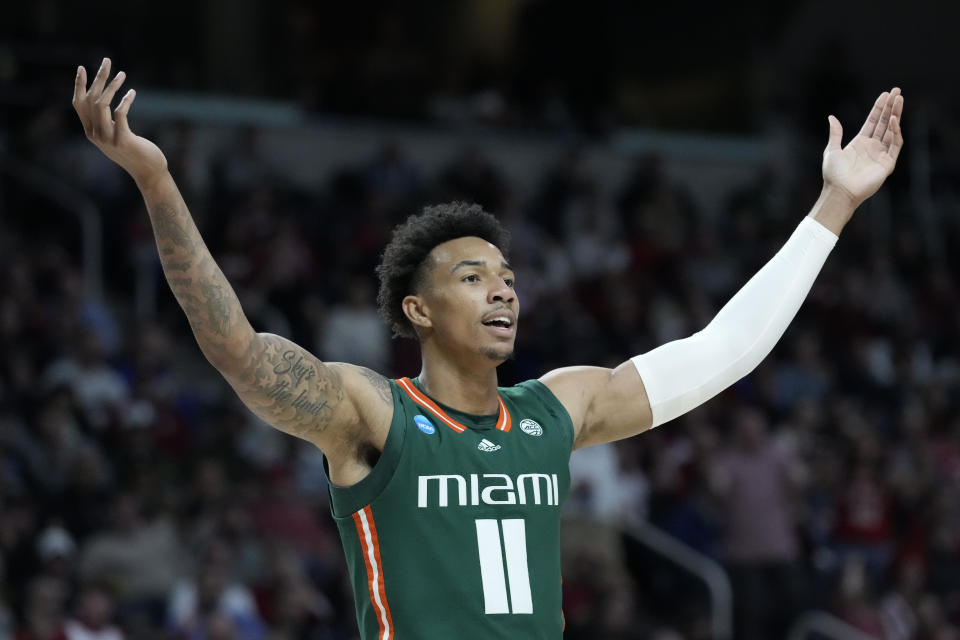 Miami's Jordan Miller (11) reacts as his team leads in the first half of a second-round college basketball game against Indiana in the NCAA Tournament, Sunday, March 19, 2023, in Albany, N.Y. (AP Photo/John Minchillo)