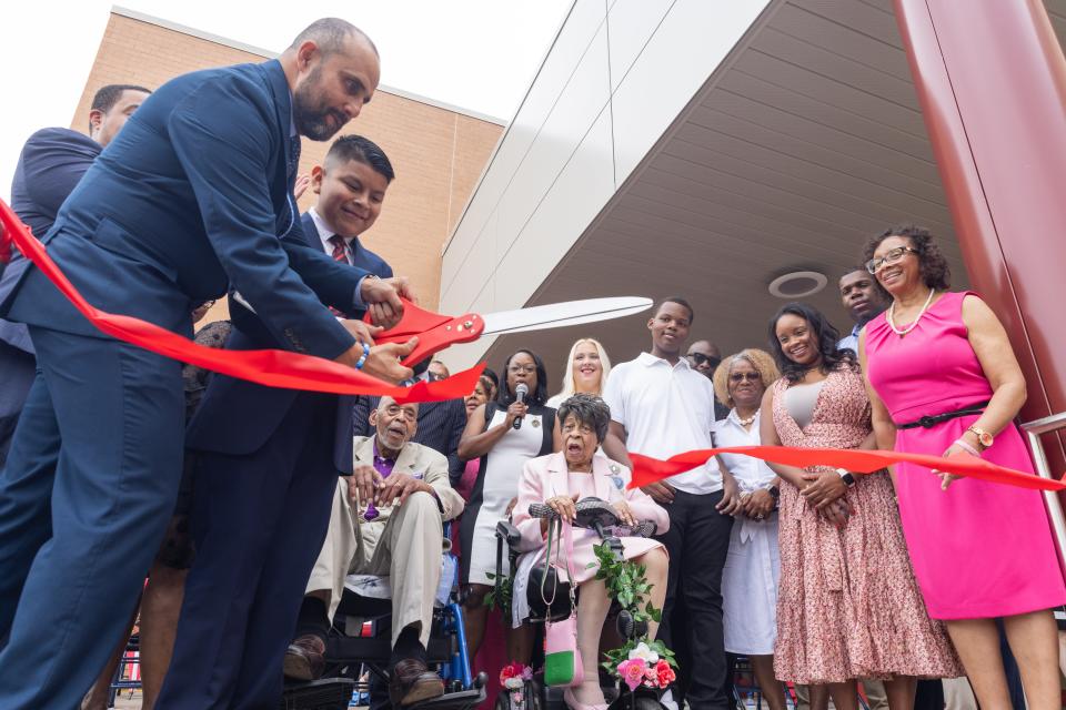 With Charles and Anna Booker looking on, the ribbon was cut Wednesday on the school in Plainfield named for them.