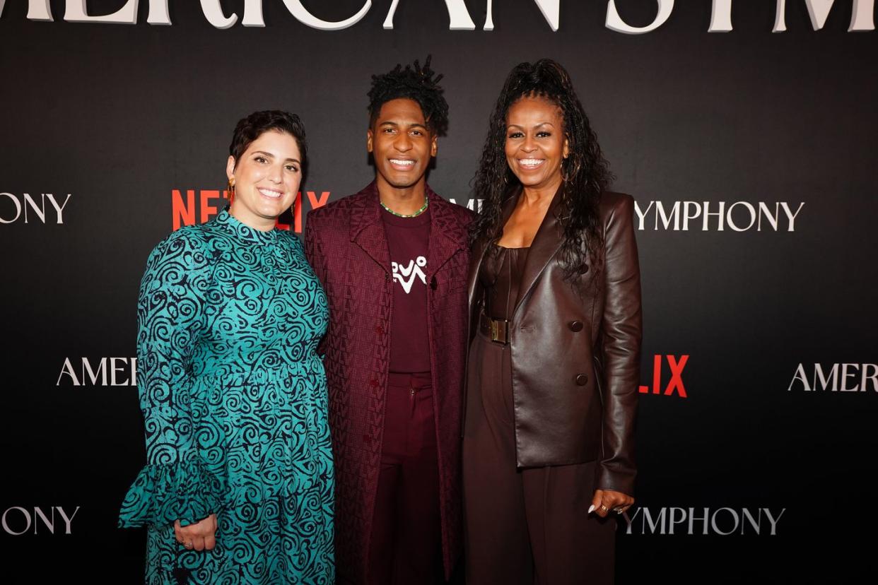 new orleans, louisiana december 07 l r suleika jaouad, jon batiste, and michelle obama attend the american symphony new orleans premiere on december 07, 2023 in new orleans, louisiana photo by erika goldringgetty images for netflix