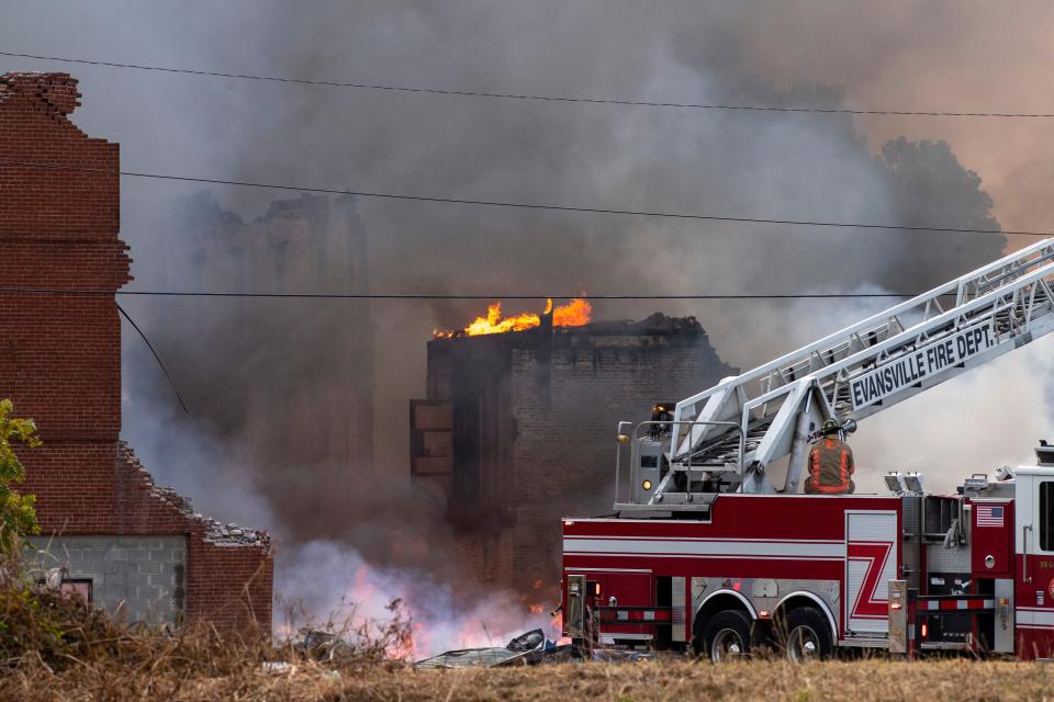 Multiple Evansville fire crews battle a large fire at 119 N. Morton Ave near the Lloyd Expressway in Evansville, Ind., Monday morning, Oct. 17, 2022.  