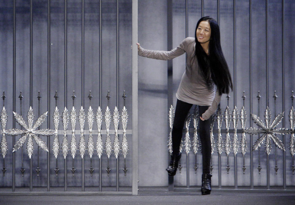 FILE - This Feb. 15, 2011 file photo shows designer Vera Wang acknowledging audience applause after her fall 2011 collection was modeled during Fashion Week in New York. Wang, 63, was honored for her lifetime achievement by the Council of Fashion Designers at its star-studded awards show Monday night. She received the award from her former employer and mentor Ralph Lauren, and she received a standing ovation from her peers. (AP Photo/Richard Drew, file)