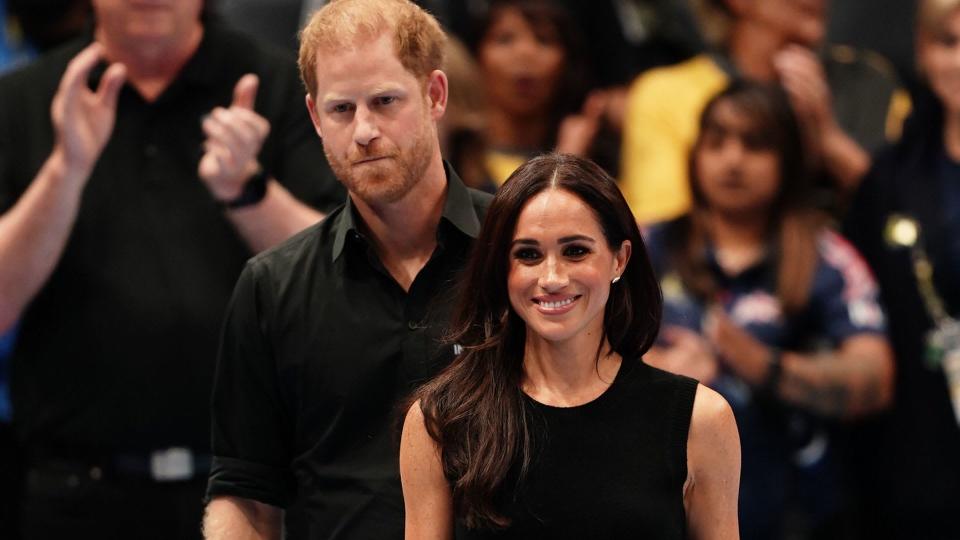 Meghan Markle wearing black Le Color skinny jeans by Frame at the Invictus Games