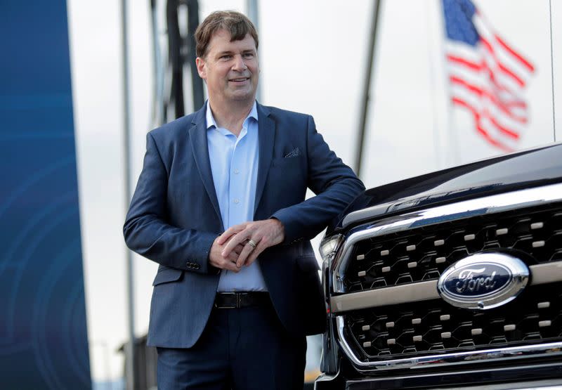 FILE PHOTO: Ford Motor Co. CEO Jim Farley poses next to a new 2021 Ford F-150 pickup truck at the Rouge Complex in Dearborn,Michigan