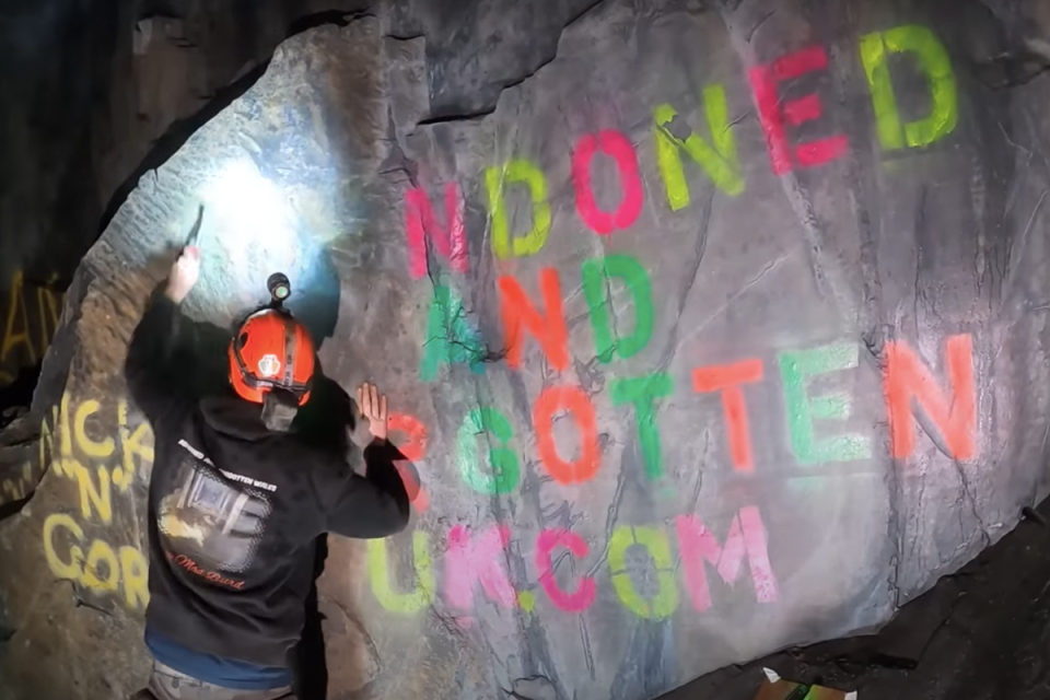 The cave was tagged with spray paint (Underground Explorer UK/YouTube)