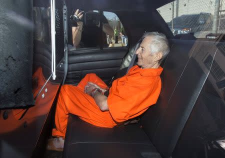 Robert Durst sits in a police vehicle as he leaves a courthouse in New Orleans, Louisiana March 17, 2015. REUTERS/Lee Celano