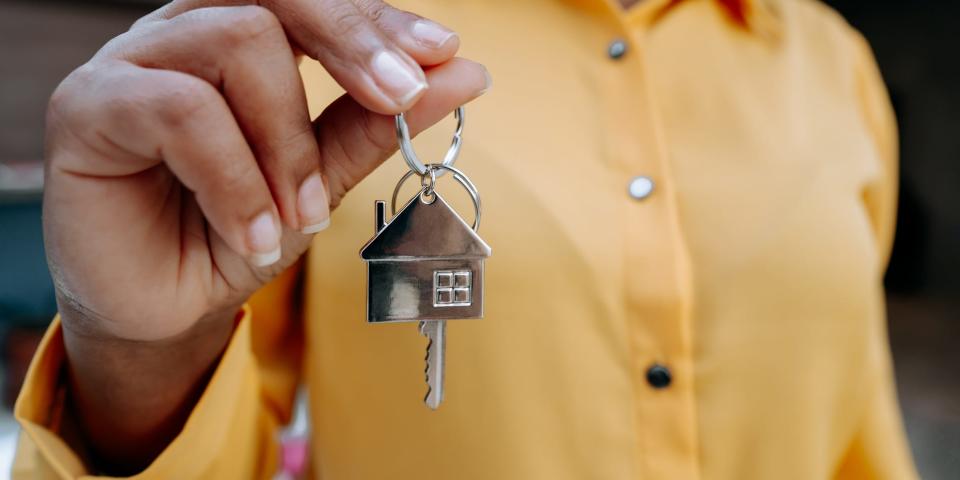 A real estate agent holding a house key