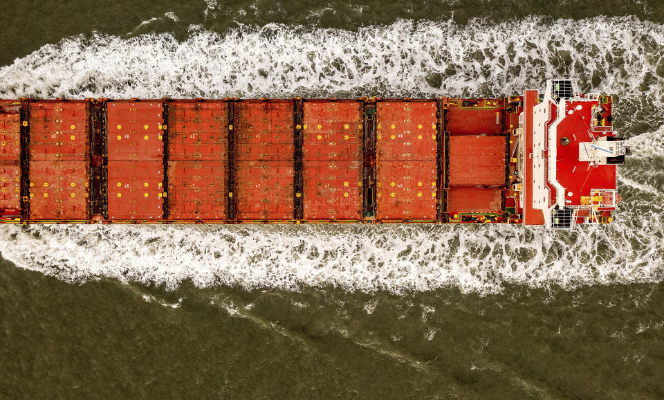 FILE - The Box Express cargo ship crosses the San Francisco Bay on Tuesday, Oct. 19, 2021, in San Francisco. The unladen vessel was en route to Long Beach. California farmers say they are having trouble exporting their crops because of delays in the global supply chain. Intense demand for products has led to a backlog of container ships outside the nation's two largest ports along the Southern California coast. (AP Photo/Noah Berger, File)