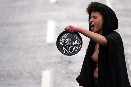 A demonstrator takes part in a protest to urge the Irish Government to repeal the 8th amendment to the constitution, which enforces strict limitations to a woman's right to an abortion, in Dublin, Ireland September 24, 2016. REUTERS/Clodagh Kilcoyne TEMPLATE OUT