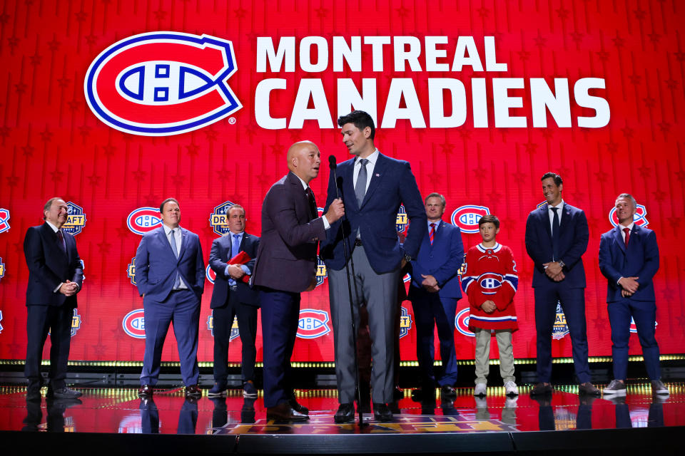 NASHVILLE, TENNESSEE - JUNE 28: Kent Hughes and Carey Price of the Montréal Canadiens are seen on stage during round one of the 2023 Upper Deck NHL Draft at Bridgestone Arena on June 28, 2023 in Nashville, Tennessee. (Photo by Bruce Bennett/Getty Images)